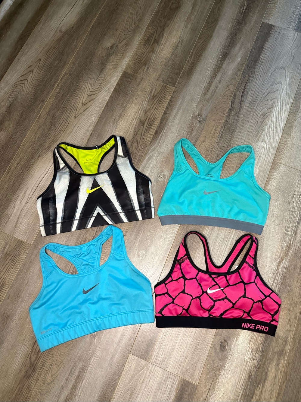 Lot of 4- Nike Women's Sport Bras - Blue, Aqua, Pink & Black